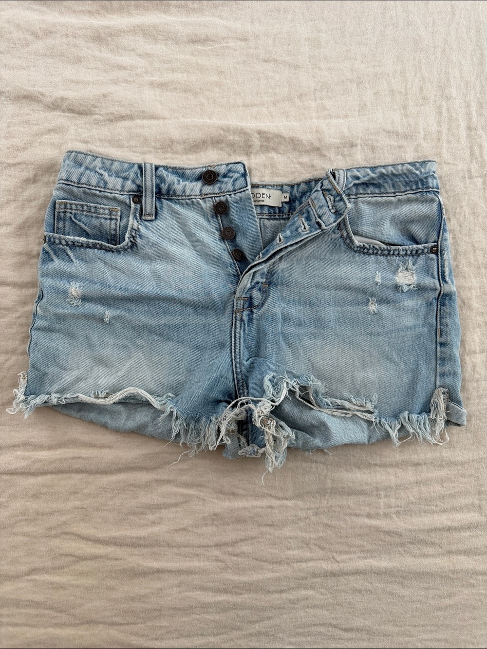Women's Light Blue Distressed Denim Shorts with Button Fly